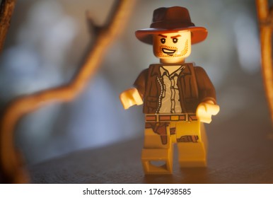 JUNE 27 2020:  Lego Mini Figure Depicting A Scene From Raiders Of The Lost Ark With Indiana Jones Running Through A Jungle