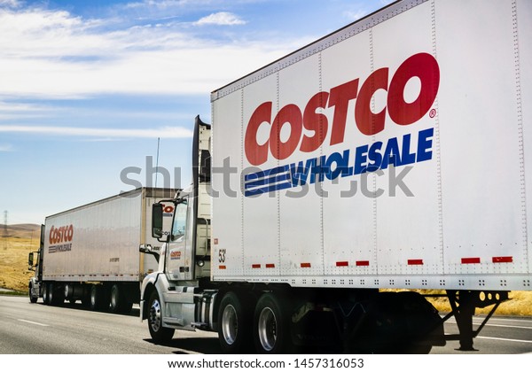 June 28, 2019 Stockton / CA / USA\
- Branded Costco Wholesale trucks driving on the freeway\
