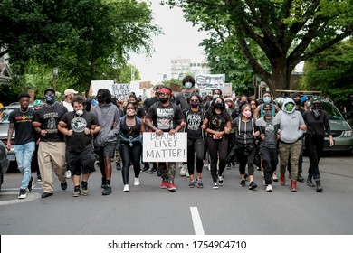 June 4, 2020, Eugene Oregon USA - Protestors March During A Peaceful Protest Hoping For Justice For George Floyd And Against Police Brutality.