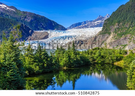 Juneau, Alaska. Mendenhall Glacier Viewpoint with reflection in the lake.