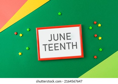 Juneteenth African American Holiday Concept With Frame Mock Up And Black Liberation Flags On Green Background