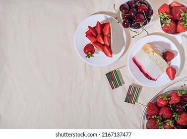 Juneteenth Day Picnic Background With Black Liberation African American Flags, Sweet Salad With Cherries And Strawberries, Strawberry Cheesecake