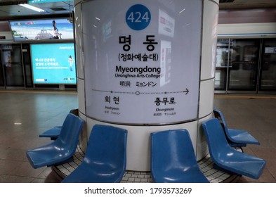 Jung, Seoul / South Korea - May 1 2018: Blue Seats Below Sign On The Empty Platform Of Myeongdong (Jeonghwa Arts College) Station On The Seoul Subway Line 4.