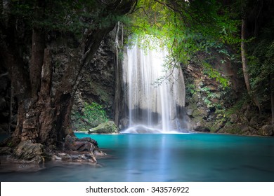 Jungle Landscape With Flowing Turquoise Water Of Erawan Cascade Waterfall At Deep Tropical Rain Forest. National Park Kanchanaburi, Thailand