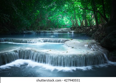 Jungle Landscape With Flowing Turquoise Water Of Erawan Cascade Waterfall At Deep Tropical Rain Forest. National Park Kanchanaburi, Thailand