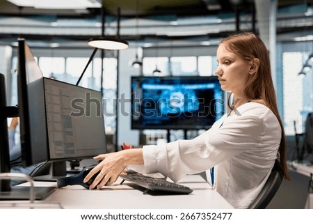 Junior dev speeding up tasks by following AI language model suggestions in office. Young woman relying on artificial intelligence LLM assistant to fix mistakes during startup internship