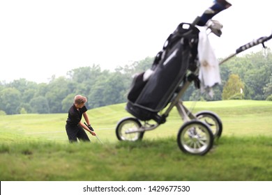 A Junior Golf Hits A Golf Shot