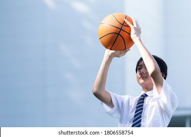 Junior high school student playing basketball
