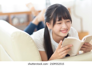 Junior high school student reading - Shutterstock ID 2109552515
