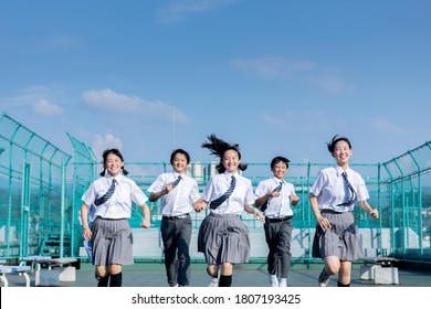 Junior High School Students Running On The Roof