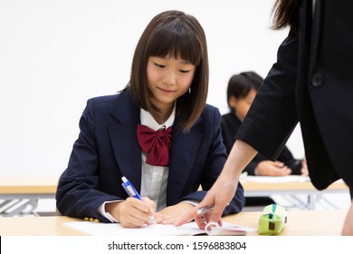 Junior High School Students Studying At A Cram School