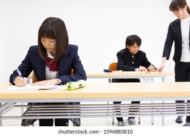 Junior High School Students Studying At A Cram School