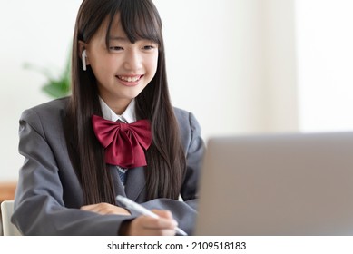 Junior high school students studying at home - Shutterstock ID 2109518183