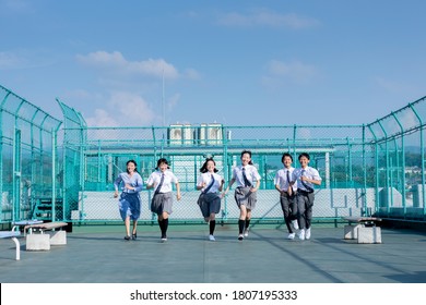 Junior High School Students And Teachers Running On The Rooftop