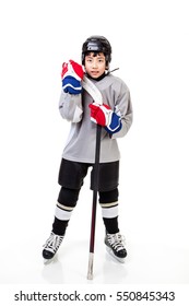 Junior Ice Hockey Player With Full Equipment And Uniform Isolated On White Background.