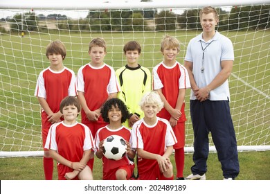 Junior Soccer Team And Coach Portrait