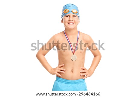 Junior swimming champion with blue swim cap and swim trunks looking at the camera isolated on white background