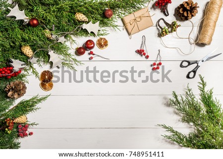 Juniper branches with a Christmas decor. Christmas, New Year background. Coniferous branches of juniper. Top view, flat design.