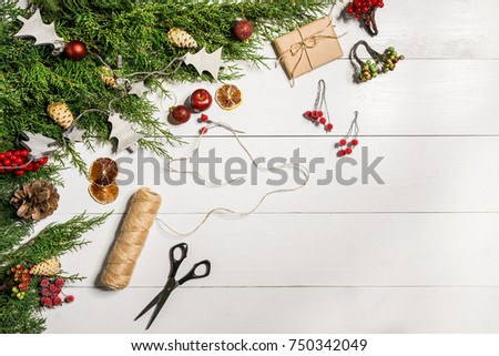 Juniper branches with a Christmas decor. Christmas, New Year background. Coniferous branches of juniper. Top view, flat design.