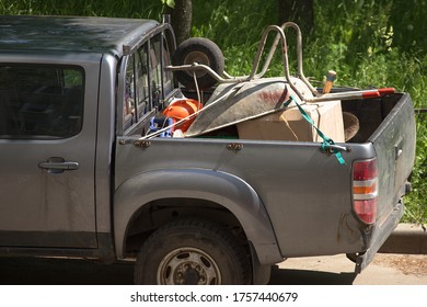 Junk In The Cargo Area Of ​​a Passenger Truck. Rear End Car