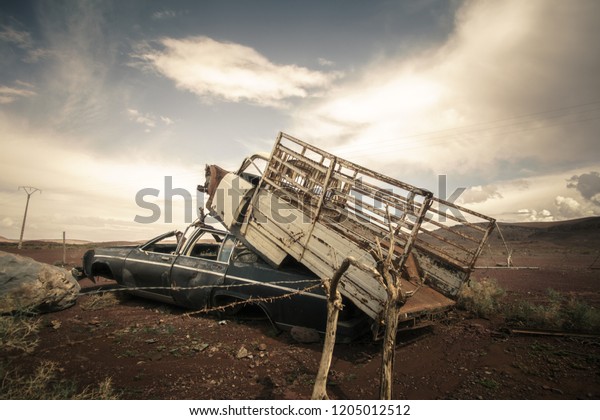 Junk cars in the desert of\
Morocco