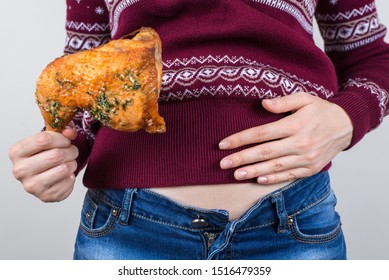 Junk food eating too much concept. Cropped close up photo of girl holding hands palm on big full abdomen feeling heartburn after fatty greasy nutrition isolated grey background