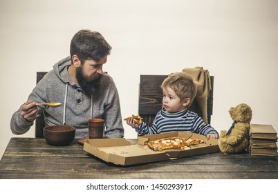 Junk food and healthy food. Father eats porridge, and son pizza. The concept of nutrition in the family. Eating habits. Italian family.