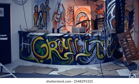 Junk and hanging electric cables left over in old degraded building by urban explorers venturing into abandoned structures. Property damage done by hooligans doing urbex, dolly in shot - Powered by Shutterstock