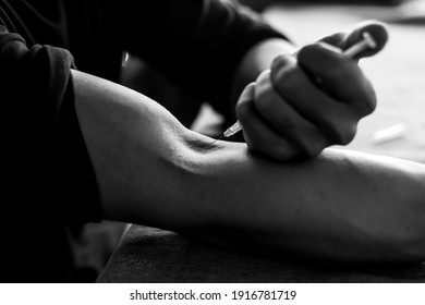 Junkie Man Or Drug Addict Men Inject Heroin Or Narcotic To Vein By Using Injection Needle And
Syringe Contain Narcotic Inside Young Person Get Drunk And Unconscious In Dark Room Black And White Photo