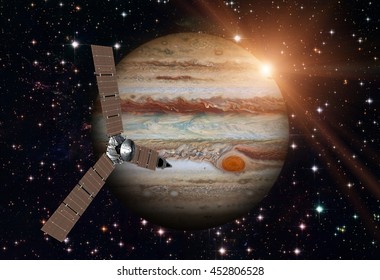 Juno Spacecraft And Jupiter. Elements Of This Image Furnished By NASA.