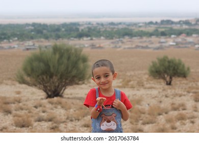 Jupar, Kerman, Iran-July 18, 2021: Kavir, Sabzeh And A Cute Boy Are Sending Kisses