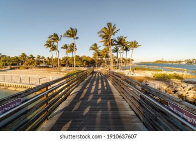 "Jupiter, FL USA 2-3-21: Walking across the bridge over the water at Jupiter Beach Park." - Shutterstock ID 1910637607