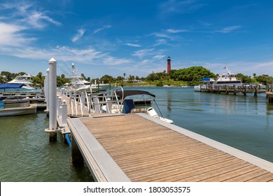 Jupiter Lighthouse And Pier With Yachts At Sunny Summer Day, West Palm Beach, Florida