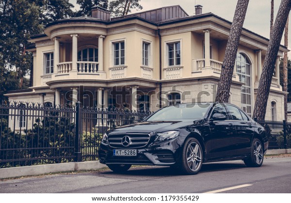 Jurmala, Latvia 12 September 2018\
Mercedes-Benz E-Class E350d Fifth generation W213 on road by the\
house on background