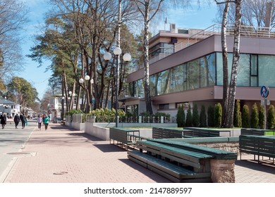 Jurmala. Latvia. April 18, 2022. Architecture of Jurmala has been preserved since the beginning of the 20th century. People walking along Jomas Street on sunny spring day.