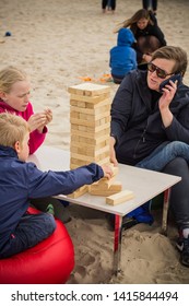 Jurmala Resort City At Majori Beach / Latvia - May, 2019: Family Playing Giant Jenga Game By The Beach During Jurmala Resort Festival