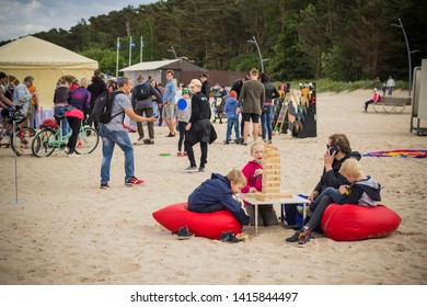 Jurmala Resort City At Majori Beach / Latvia - May, 2019: Family Playing Giant Jenga Game By The Beach During Jurmala Resort Festival