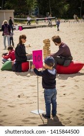 Jurmala Resort City At Majori Beach / Latvia - May, 2019: Family Playing Giant Jenga Game By The Beach During Jurmala Resort Festival