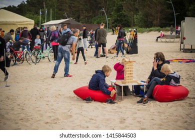 Jurmala Resort City At Majori Beach / Latvia - May, 2019: Family Playing Giant Jenga Game By The Beach During Jurmala Resort Festival