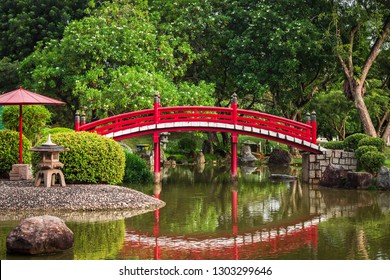 Jurong East, Singapore - January 15, 2015: a red wooden bridge at the Japanese Garden inside the Chinese Garden in Jurong East, Singapore. - Powered by Shutterstock