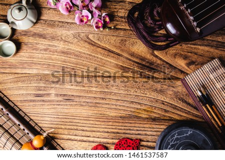 Just above the angle of view close up Chinese style decoration on the wooden table Guqindong Taiwan writing brush tea set etc.