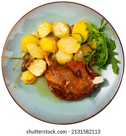 Just Cooked Portion Of Duck Confit With Fried Poatoes. Isolated Over White Background