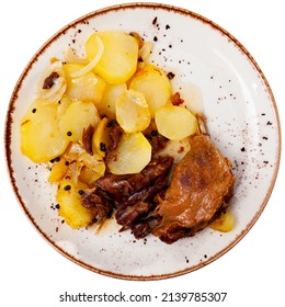 Just Cooked Portion Of Duck Confit With Fried Poatoes. Isolated Over White Background