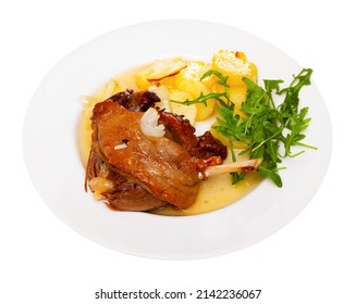 Just Cooked Portion Of Duck Confit With Fried Poatoes. Isolated Over White Background