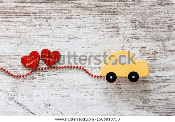 Just married\
car with hearts. Wedding\
concept.