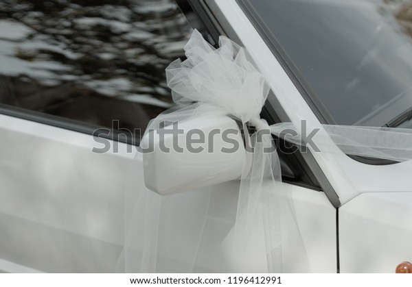Just married car with a white bow on the driving\
mirror (Marche, Italy,\
Europe)