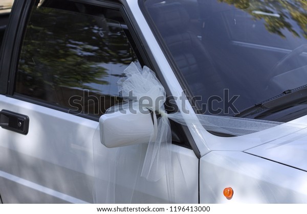 Just married car with a white bow on the driving
mirror (Marche, Italy,
Europe)