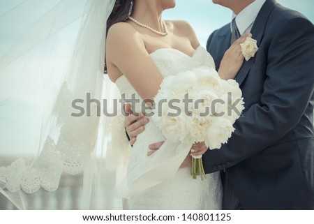 Just married couple embraced