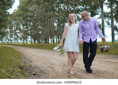 Just married lovers walking in field in autumn day - Shutterstock ID 640098625