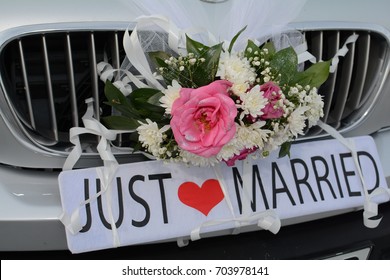 Just Married Sign Attached On Car's Trunk